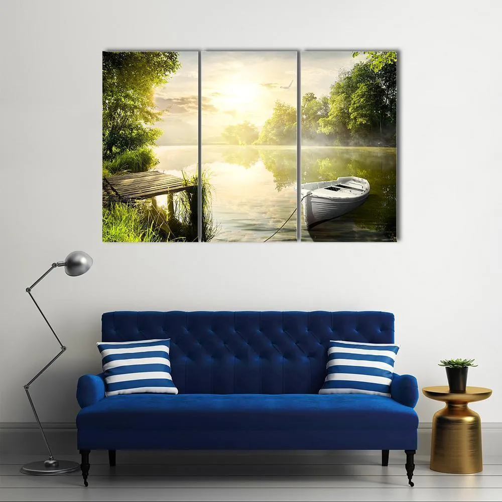 Boat On River Bank Canvas Wall Art